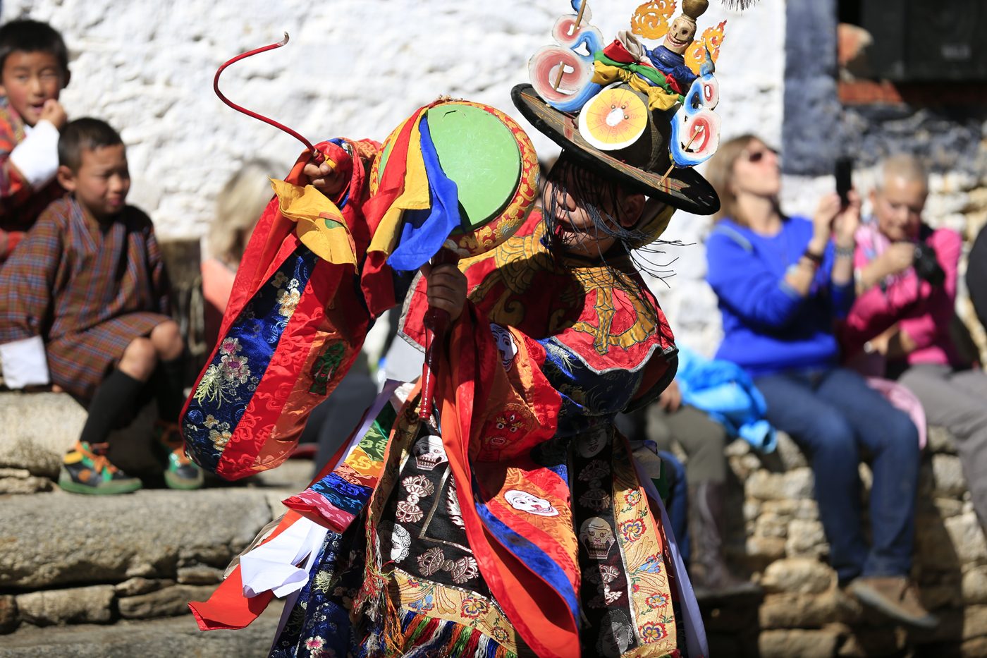 A Cham masked dancer in full festival costume